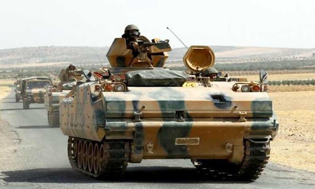 Turkish armoured personnel carriers escort military vehicles on a main road in Karkamis on the Turkish-Syrian border in the southeastern Gaziantep province, Turkey, August 26, 2016. (Photo: Reuters/Umit Bektas)