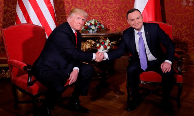 U.S. President Donald Trump is greeted by Polish President Andrzej Duda as he visits Poland during the Three Seas Initiative Summit in Warsaw, Poland July 6, 2017. REUTERS/Carlos Barria