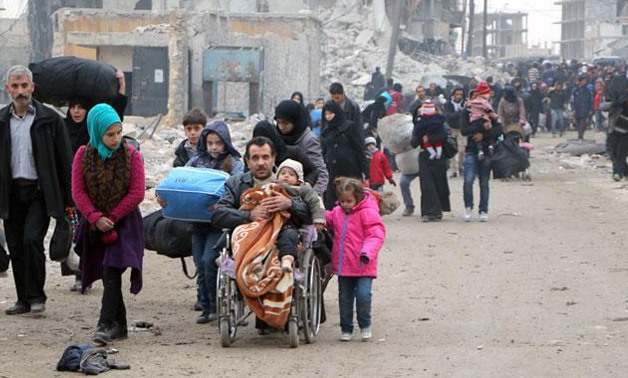 Syria refugees land in France under corridor scheme - AFP