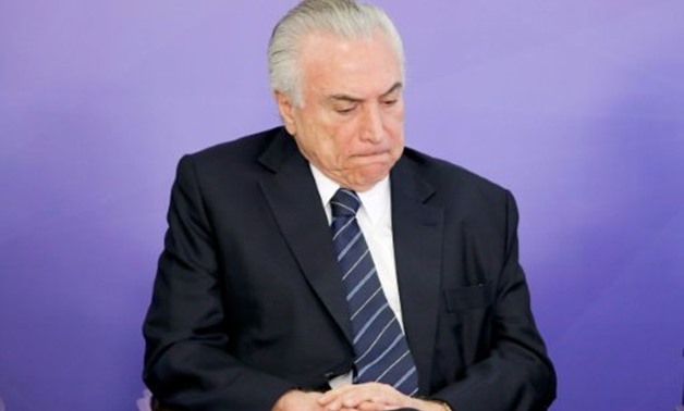 © AFP/File | Brazil's consumer prices fell for the first time in over a decade, and the inflation rights turned negative, which could potentially benefit President Michel Temer, pictured on July 6, 2017
