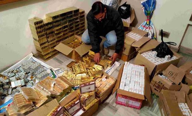 An NCB team member checks stock of ayurvedic medicines seized during a raid in Amritsar on Thursday. Photo: Vishal Kumar CC
