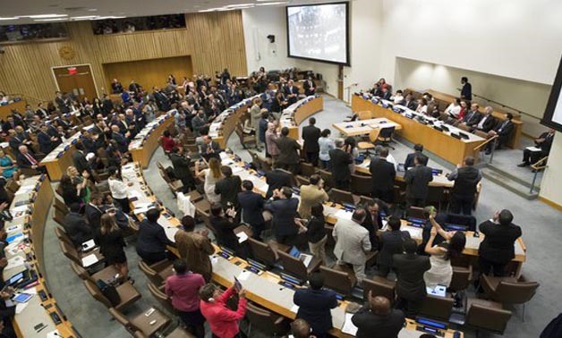 Delegates give a standing ovation after a vote by the conference to adopt a legally binding instrument to prohibit nuclear weapons, leading towards their total elimination, Friday, July 7, 2017 at United Nations headquarters. More than 120 countries have 