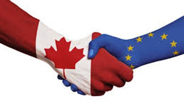 Handshake between the EU and Canada (painted hands)
