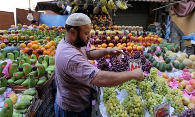 An Egyptian fruit seller is seen at a market in Cairo, Egypt June - REUTERS/Mohamed Abd El Ghany