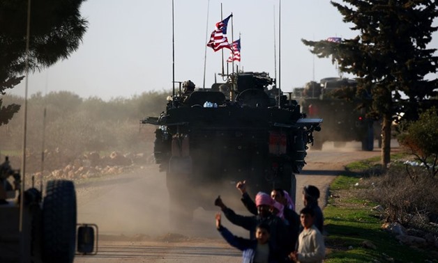 A convoy of American armored vehicles in Manbij, northern Syria, on Sunday. The formal troop cap for Syria is 503, but commanders have the authority to temporarily exceed that limit to meet military requirements.