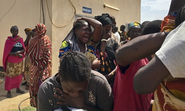  Relatives of the six aid workers who were ambushed and killed grieve outside the morgue in Juba, South Sudan. Photograph: AP
