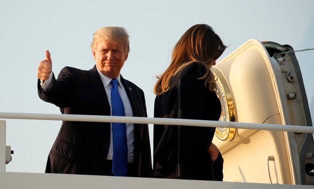 U.S. President Donald Trump gives a thumbs up as he and first lady Melania Trump board Air Force One as they depart Joint Base Andrews in Maryland, U.S., July 12, 2017. REUTERS/Kevin Lamarque TPX IMAGES OF THE DAY

