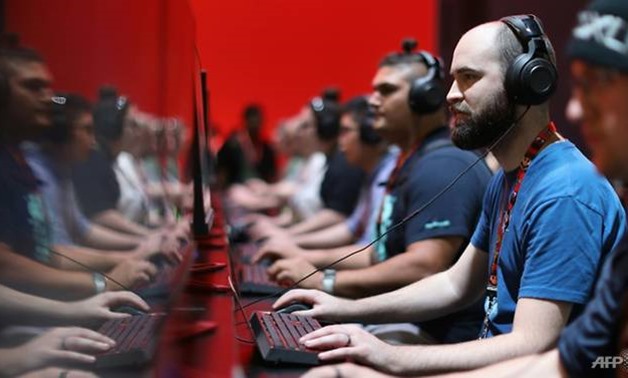 Analysts expect consumer demand for PCs to remain under pressure, but see potential boosts from the growing popularity of powerful computers for game play and sleek new Windows machines. (AFP/Christian Petersen)