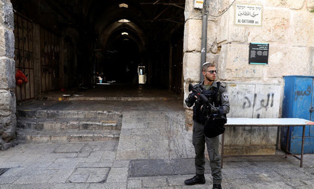 An Israeli border policeman secures the entrance to the compound known to Muslims as Noble Sanctuary and to Jews as Temple Mount, in Jerusalem's Old City July 14, 2017. REUTERS
