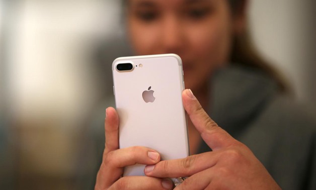 FILE PHOTO: A customer views the new iPhone 7 smartphone inside an Apple Inc. store in Los Angeles, California, U.S., September 16, 2016.