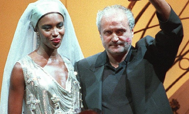 The fashion world was plunged into mourning by the killing of stylist to the stars Gianni Versace, seen with Naomi Campbell wearing one of his creations (AFP Photo/PIERRE VERDY)
