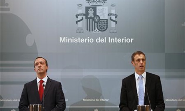 Director of Europol Rob Wainwright (R) speaks next to Spain's Security State Secretary Francisco Martinez during a news conference at the Interior Ministry in Madrid - Reuters