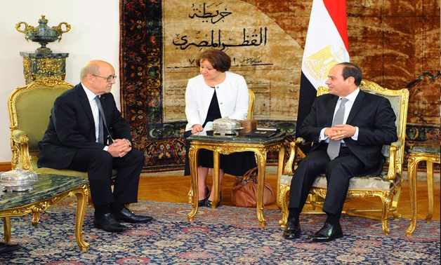 President Abdel Fattah El Sisi meets with Foreign Minister of France Jean-Yves Le Drian in June- Press Photo.