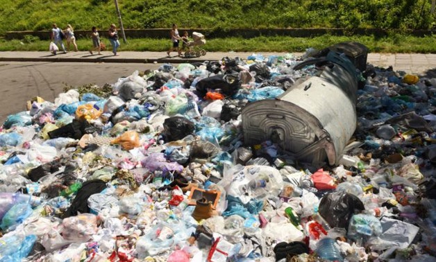 Ukraine's western city of Lviv is famous for its picture-postcard graceful domes and cobblestone streets but it's not such a pretty sight in the back alleys, which are blighted by growing mountains of garbage. PHOTO: AFP