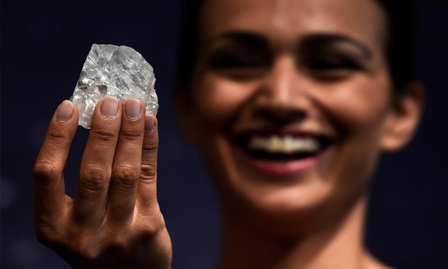 model shows off the 1109 carat "Lesedi La Rona", the largest gem quality rough diamond discovered in over 100 years during a sale preview at Sotheby's auction house in London, Britain, June 14, 2016. - Reuters