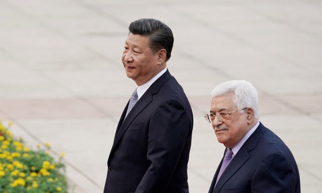 China's President Xi Jinping and Palestinian President Mahmoud Abbas attend a welcoming ceremony in Beijing - Reuters