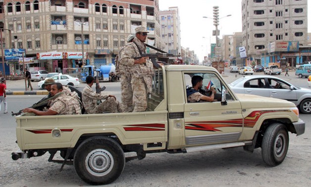 Yemeni Army soldiers patrol a street in Mansoura District, in Aden - Reuters