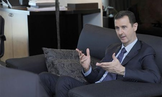 Syria's President Bashar al-Assad speaks during an interview with a Russian newspaper in Damascus - Reuters