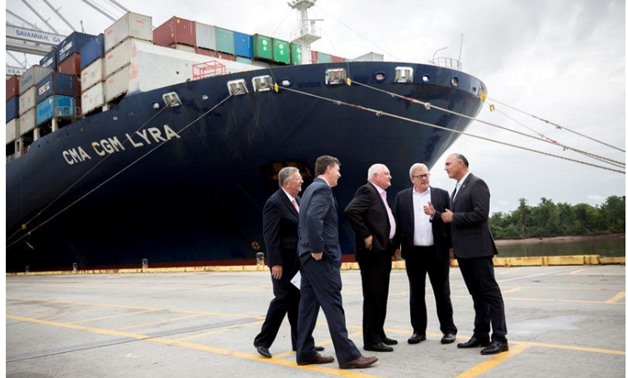 U.S. Secretary of Agriculture Sonny Perdue (C), Canadian Agriculture Minister Lawrence MacAulay (2nd R) and Mexican Secretary of Agriculture José Calzada Rovirosa (R) listen to Georgia Ports Authority Executive Director Griff Lynch (2nd L) during a tour o