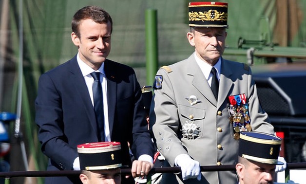 French President Emmanuel Macron and Chief of the Defence Staff French Army General Pierre de Villiers attend the traditional Bastille Day military parade on the Champs-Elysees in Paris - Reuters