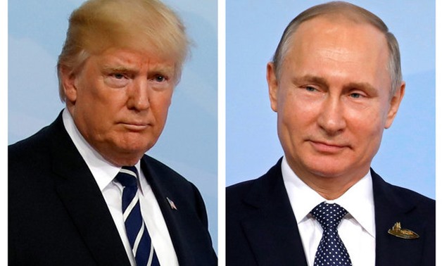 FILE PHOTO - A combination of two photos shows U.S. President Donald Trump and Russian President Vladimir Putin as they arrive for the G20 leaders summit in Hamburg, Germany, July 7, 2017. REUTERS/Carlos Barria/File Photo