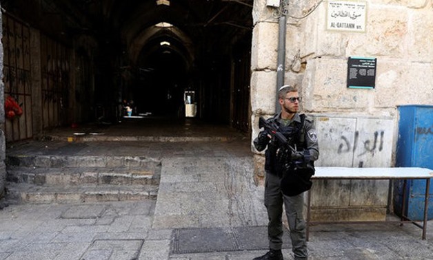 An Israeli border policeman secures the entrance to the compound known to Muslims as Noble Sanctuary and to Jews as Temple Mount, in Jerusalem's Old City July 14, 2017. REUTERS
