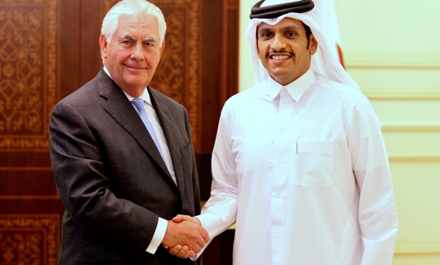 Qatar's foreign minister Sheikh Mohammed bin Abdulrahman al-Thani (R) shakes hands with U.S. Secretary of State Rex Tillerson following a joint news conference in Doha, Qatar, July 11, 2017. REUTERS/Naseem Zeitoon