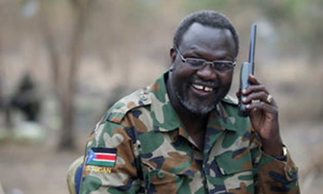 Riek Machar, South Sudan's then rebel leader, talking on the phone in his field office in a rebel-controlled territory in Jonglei State - Reuters