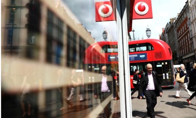 A branded sign is displayed on a Vodafone store in London - Reutres/Neil Hall