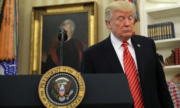 U.S. President Donald Trump leaves after a meeting with survivors from the USS Arizona in the Oval Office of the White House in Washington, U.S., July 21, 2017. REUTERS/Carlos Barria

