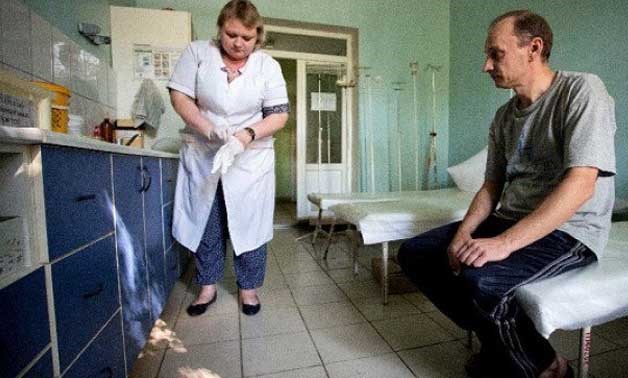 A patient waits in a hospital treating drug users in the rebel capital of Donetsk, Ukraine. PHOTO: AFP
