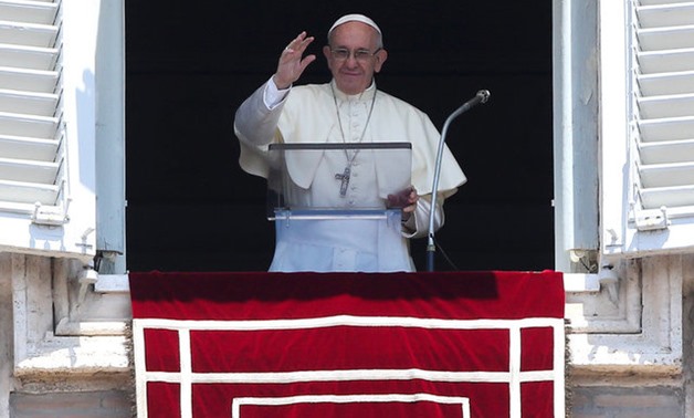 Pope Francis waves as he leads Sunday Angelus prayer in Saint Peter's square at the Vatican - Reuters