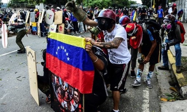 © AFP | Four months of almost daily street protests in Venezuela have left 103 people dead
