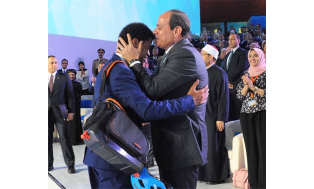 Yassin Zoghby sitting next to President Sisi – Press Photo