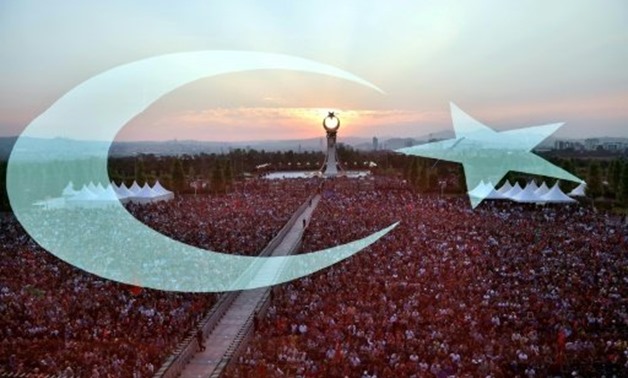 © TURKISH PRESIDENTIAL PRESS SERVICE/AFP/File | People attend the opening ceremony of the July 15 martyrs? monument in Ankara on July 16, 2017
