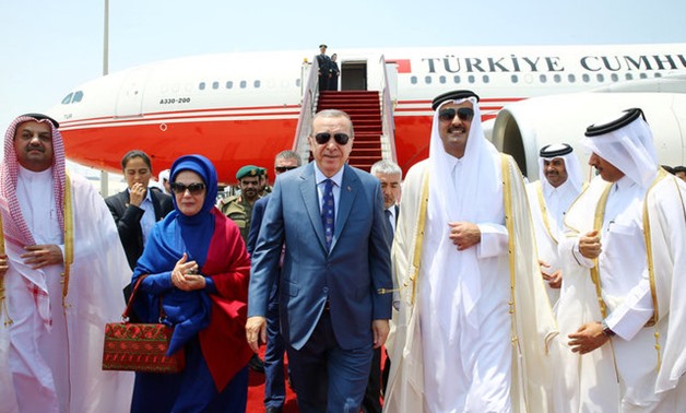 Turkish President Tayyip Erdogan is welcomed by Emir of Qatar Sheikh Tamim Bin Hamad Al-Thani in Doha - Reuters