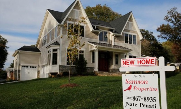 A real estate sign advertising a new home for sale is pictured in Vienna, Virginia, U.S. October 20, 2014 - Reuters
