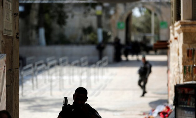 Israeli security personnel patrol the entrance of the compound known to Muslims as Noble Sanctuary and to Jews as Temple Mount at morning after Israel removed the new security measures there, in Jerusalem's Old City July 25, 2017. REUTERS/Ronen Zvulun

