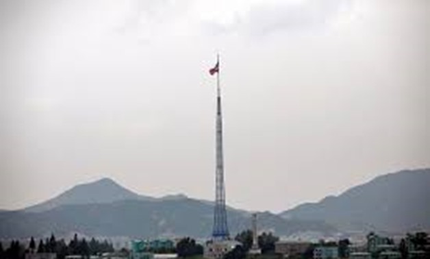 A North Korean flag flutters on top of a tower at the propaganda village of Gijungdong in North Korea, in this picture taken near the truce village of Panmunjom, South Korea July 19, 2017.
