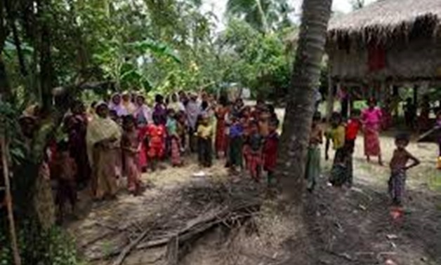 Rohingya villagers watch as international media visit Maung Hna Ma village, Buthidaung township, northern Rakhine state, Myanmar July 14, 2017. Picture taken July 14, 2017.
