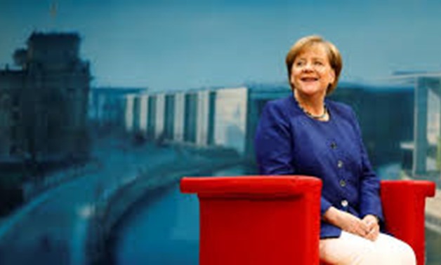 FILE PHOTO: German Chancellor Angela Merkel arrives for a TV interview by ARD public broadcaster in Berlin, Germany July 16, 2017.
