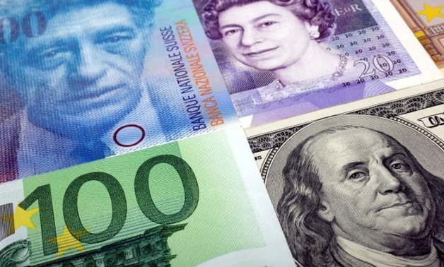 FILE PHOTO: A picture illustration of U.S. dollar, Swiss franc, British pound and Euro bank notes January 26, 2011. Kacper Pempel/Illustration