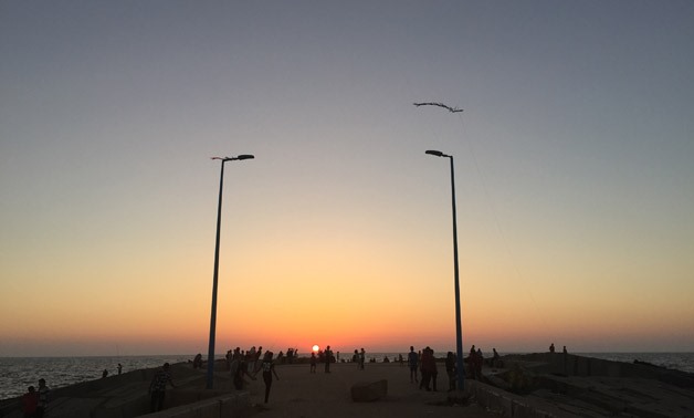 Sunset at the sea pier near San Stefano beach in Alexandria - Monika Sleszynska