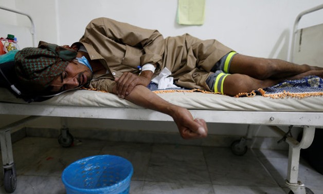 A man lies on the bed of a cholera treatment center in Sanaa, Yemen, May 15, 2017. REUTERS