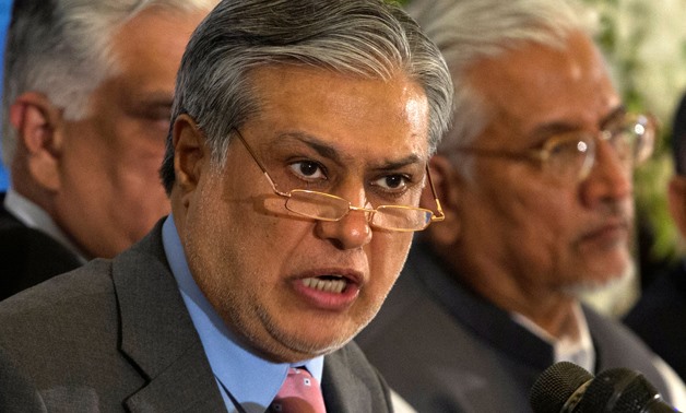 Pakistan's Finance Minister Ishaq Dar announces the result of the first auction for 3G mobile phone networks during a news conference in Islamabad April 23, 2014. REUTERS/Mian Khursheed/File Photo