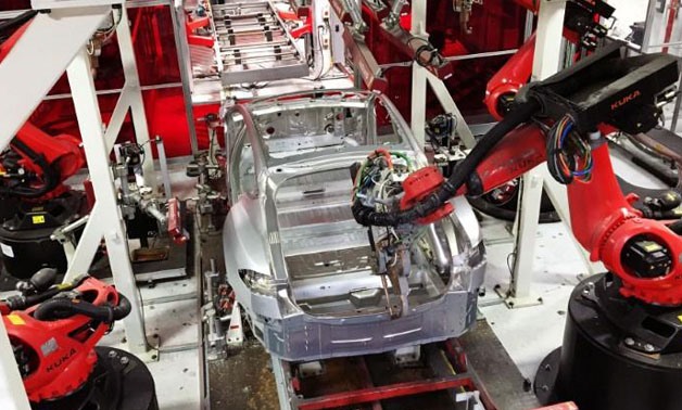 FILE PHOTO - Tesla vehicles are being assembled by robots at Tesla Motors Inc factory in Fremont, California, U.S. on July 25, 2016. Joseph White