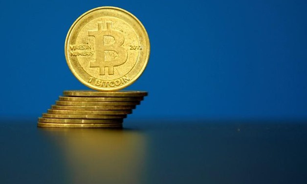 FILE PHOTO: Bitcoin (virtual currency) coins are seen in an illustration picture taken at La Maison du Bitcoin in Paris, France, May 27, 2015.
Benoit Tessier