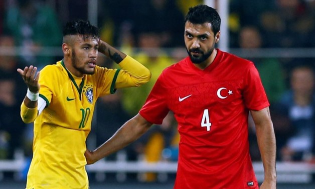 Bekir Irtegun of Turkey (R) conforts Neymar of Brazil (L) after a foul during their international friendly soccer match against Turkey at Sukru Saracoglu stadium