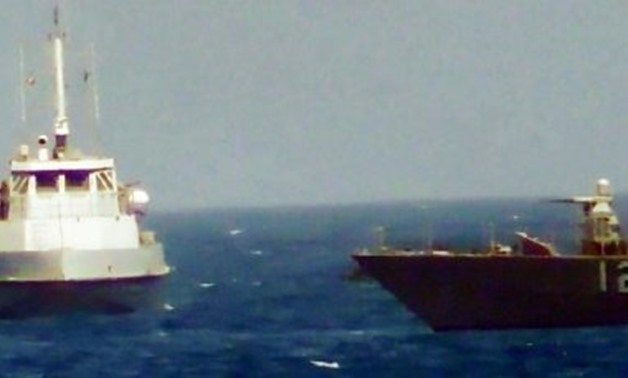 © US NAVY/AFP | This video grab still image obtained on July 25, 2017, courtesy of the US Navy, shows an Iranian Revolutionary Guards boat heading towards the USS Thunderbolt in the Gulf
