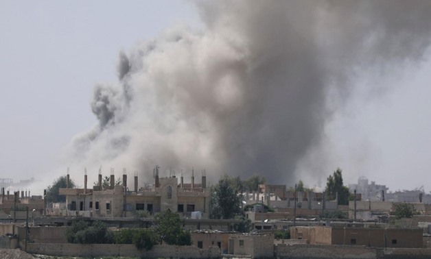 Smoke rises from the al-Mishlab district at Raqqa’s southeastern outskirts on 7 June Reuters